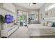 A relaxing bedroom with a sliding glass door leading to an outdoor pool and a personal treadmill at 27740 Water Ash Dr, Wesley Chapel, FL 33544