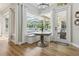 Bright breakfast nook with window seat overlooking pool and access to outdoor patio at 27740 Water Ash Dr, Wesley Chapel, FL 33544