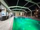 Screened pool with LED lighting and brick patio for outdoor enjoyment at 27740 Water Ash Dr, Wesley Chapel, FL 33544