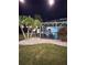 Landscaped backyard with a screened in pool and patio area, perfect for relaxation and entertaining at 27740 Water Ash Dr, Wesley Chapel, FL 33544
