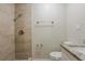 Updated bathroom features a tiled walk-in shower and granite-topped vanity at 4226 E Emma St, Tampa, FL 33610