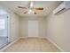 Cozy bedroom features tile flooring, air conditioner and ceiling fan at 4226 E Emma St, Tampa, FL 33610