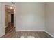 A well-lit bedroom with wood-look flooring leads to other rooms at 4226 E Emma St, Tampa, FL 33610