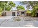 Charming single-story home featuring a freshly painted facade, a minimalist front yard, and a welcoming entrance at 4226 E Emma St, Tampa, FL 33610