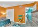 Bright bedroom featuring a closet, dresser, and neutral-toned walls at 680 71St Ave # 9, St Pete Beach, FL 33706
