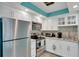 Bright kitchen with stainless steel appliances, granite countertops, and ample storage space at 680 71St Ave # 9, St Pete Beach, FL 33706