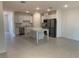Open-concept kitchen features stainless steel appliances and a granite countertop island at 32122 Eastern Redbud Br, San Antonio, FL 33576