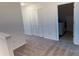 Upstairs loft area with a closet and adjacent laundry room at 32122 Eastern Redbud Br, San Antonio, FL 33576