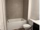Bathroom featuring a tiled shower-tub combination and modern fixtures at 32128 Eastern Redbud Br, San Antonio, FL 33576