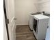 Convenient laundry room features a modern washer and dryer, plus storage at 32128 Eastern Redbud Br, San Antonio, FL 33576
