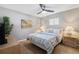 Cozy bedroom featuring a full-size bed, ceiling fan, and neutral decor, ideal for relaxation at 5511 1St Avenue Nw Dr, Bradenton, FL 34209