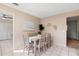 Cozy dining area adjacent to the kitchen, featuring a dining table and comfortable seating for six at 5511 1St Avenue Nw Dr, Bradenton, FL 34209