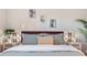 Bedroom showcasing a comfortable bed with decorative pillows, complemented by stylish bedside lamps and modern artwork at 5511 1St Avenue Nw Dr, Bradenton, FL 34209