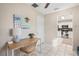 Bright Office featuring desk with a wicker chair and decor with a view into the kitchen at 5511 1St Avenue Nw Dr, Bradenton, FL 34209
