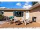 Cozy patio with Adirondack chairs around a fire pit, perfect for outdoor entertaining at 5511 1St Avenue Nw Dr, Bradenton, FL 34209