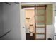 Bathroom featuring a modern sliding door, toilet and hanging plants for extra coziness at 821 Silver Springs Nw Ter, Port Charlotte, FL 33948