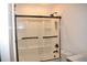 Renovated bathroom with a glass shower door and matte black hardware at 821 Silver Springs Nw Ter, Port Charlotte, FL 33948