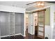 Bedroom featuring a closet, modern sliding door, and access to bathroom and lots of natural light at 821 Silver Springs Nw Ter, Port Charlotte, FL 33948