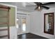 Bedroom boasts a ceiling fan, modern sliding door and french doors that leads to the outdoor pool at 821 Silver Springs Nw Ter, Port Charlotte, FL 33948