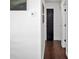 Hallway showcasing modern interior design, including sleek black doors and minimalist wall decor at 821 Silver Springs Nw Ter, Port Charlotte, FL 33948