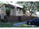 Charming condo with a brown fence, lush green lawn, and convenient parking at 870 Village Lake N Ter # 204, St Petersburg, FL 33716