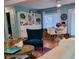 Bright living room and dining area featuring a bookshelf and dining table with seating at 9790 66Th N St # 100, Pinellas Park, FL 33782