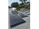 Roof-mounted solar panels offer energy efficiency for this home, reducing utility costs and promoting sustainable living at 2580 68Th S Ave, St Petersburg, FL 33712