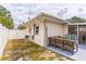 Backyard showing patio and grassy area, along with the exterior of the home at 5710 92Nd N Ter, Pinellas Park, FL 33782