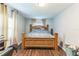 This bedroom has hard wood floors, curtains and lots of natural light at 5710 92Nd N Ter, Pinellas Park, FL 33782