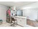 Open-concept kitchen with marble countertops, stainless steel refrigerator, and bar stool seating at 5710 92Nd N Ter, Pinellas Park, FL 33782