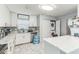 Bright kitchen with white cabinets, marble countertops, and stainless steel appliances at 5710 92Nd N Ter, Pinellas Park, FL 33782