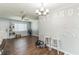 Open-concept living room features wood-look floors, a ceiling fan and natural light at 5710 92Nd N Ter, Pinellas Park, FL 33782