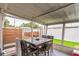 Relaxing screened patio with outdoor seating, a wooden privacy screen, and a hot tub at 5710 92Nd N Ter, Pinellas Park, FL 33782