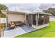 Outdoor patio features a seating area and screened in porch at 5710 92Nd N Ter, Pinellas Park, FL 33782