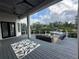 Spacious covered back porch with plenty of seating and river views at 608 Bittner Blvd, Nokomis, FL 34275