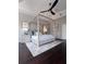 Beautiful main bedroom featuring a four-poster bed, ceiling fan and wood floors at 608 Bittner Blvd, Nokomis, FL 34275