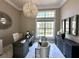 Bright home office featuring a large window, sophisticated light fixture and stylish decor at 608 Bittner Blvd, Nokomis, FL 34275