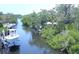 Tranquil waterfront with private boat dock and lush, mature landscaping at 608 Bittner Blvd, Nokomis, FL 34275
