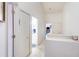 Bright hallway with closet, leading to the bathroom and other rooms in the home at 232 Countryside Key Blvd, Oldsmar, FL 34677