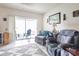 Living area with comfortable seating, tile floor, view of a screened porch, and plenty of natural light at 232 Countryside Key Blvd, Oldsmar, FL 34677