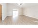 Spacious living room features wood-look floors and sliding glass doors to the outside at 24237 Rolling View Ct, Lutz, FL 33559