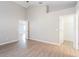 Large main bedroom with wood-look floors and private access to ensuite bathroom and closet at 24237 Rolling View Ct, Lutz, FL 33559