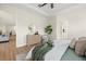 Serene main bedroom showcasing neutral decor, a ceiling fan and private ensuite bathroom at 2919 Cascabel Ter, North Port, FL 34286
