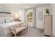 Serene bedroom retreat featuring soft natural light, carpet floors, and calming décor with relaxing vibes at 16408 Courlan Rd, Weeki Wachee, FL 34614
