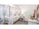 Whimsical bedroom featuring a canopy bed, colorful decor, and ample natural light at 16408 Courlan Rd, Weeki Wachee, FL 34614