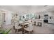 Open-concept design with a dining area that flows seamlessly into a modern kitchen and living space at 16408 Courlan Rd, Weeki Wachee, FL 34614