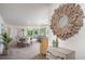Bright dining area featuring a table set for six, modern accents, hardwood floors, and ample natural light at 16408 Courlan Rd, Weeki Wachee, FL 34614