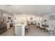 Spacious open-concept living area with a well-appointed kitchen, adjacent dining space, and stylish decor touches at 16408 Courlan Rd, Weeki Wachee, FL 34614