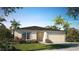 Charming single-story home with manicured lawn, landscaping, a two-car garage and a welcoming facade at 16408 Courlan Rd, Weeki Wachee, FL 34614