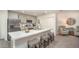 Contemporary kitchen with an island, stainless steel appliances, and lots of cabinets, great for cooking and entertaining at 16408 Courlan Rd, Weeki Wachee, FL 34614